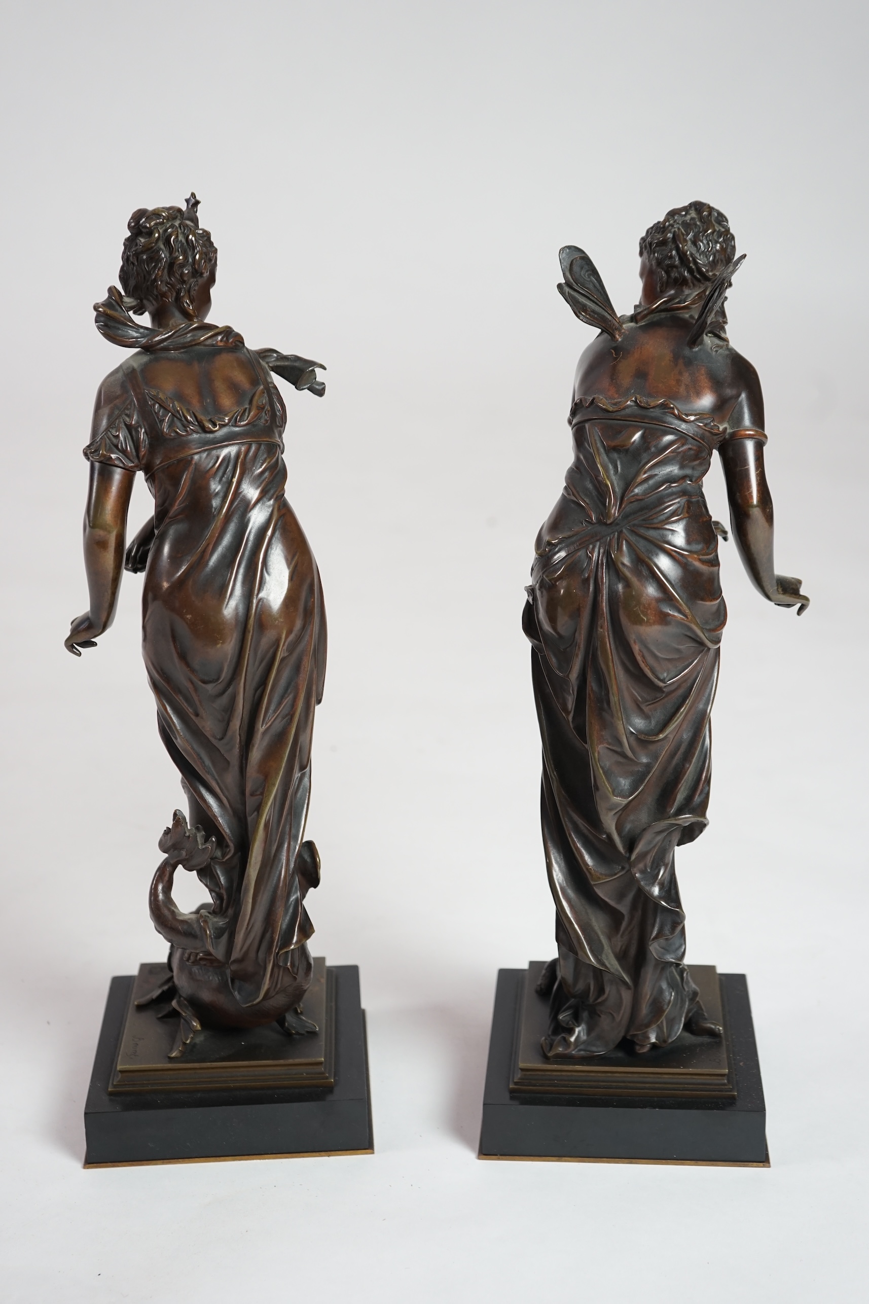 Eutrope Bouret, (French 1833-1906). A pair of late 19th century patinated bronze figures of Venus riding a dolphin and a nymph riding a tortoise